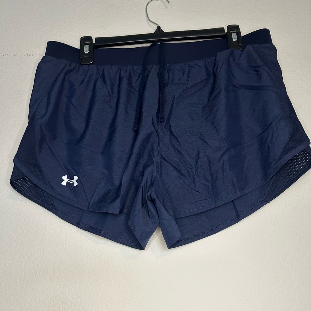 NWOT under Armour, heat gear, navy blue ladies athletic shorts, size Large